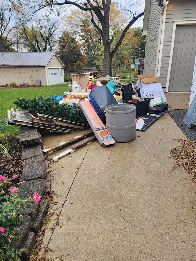 Dumpster being loaded with debris for Commercial Dumpster Rental in Smithfield